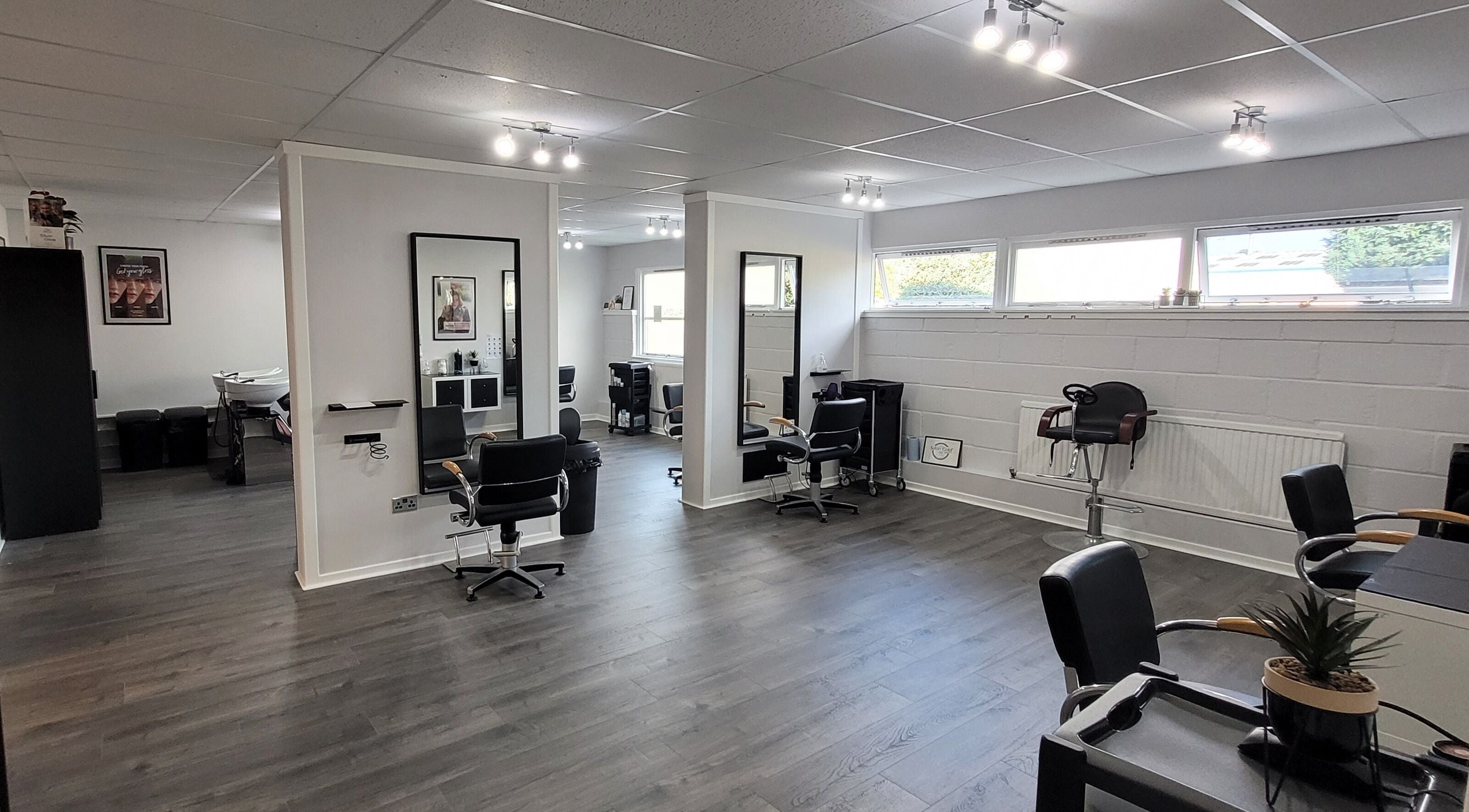 Modern interior of Salon 10, Dalgety Bay, Scotland, GB with sleek chairs and stylish decor.