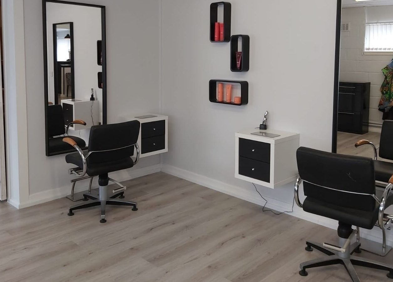 Modern salon styling chairs at Salon 10, Dalgety Bay, Scotland, GB, featuring elegant mirrors and decor.