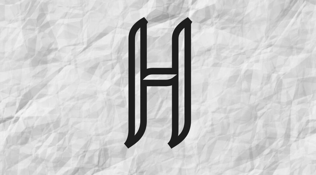 Stylish 'H' logo for Hair by Holli J at Home Halifax, Halifax, England, GB on a textured grey background.