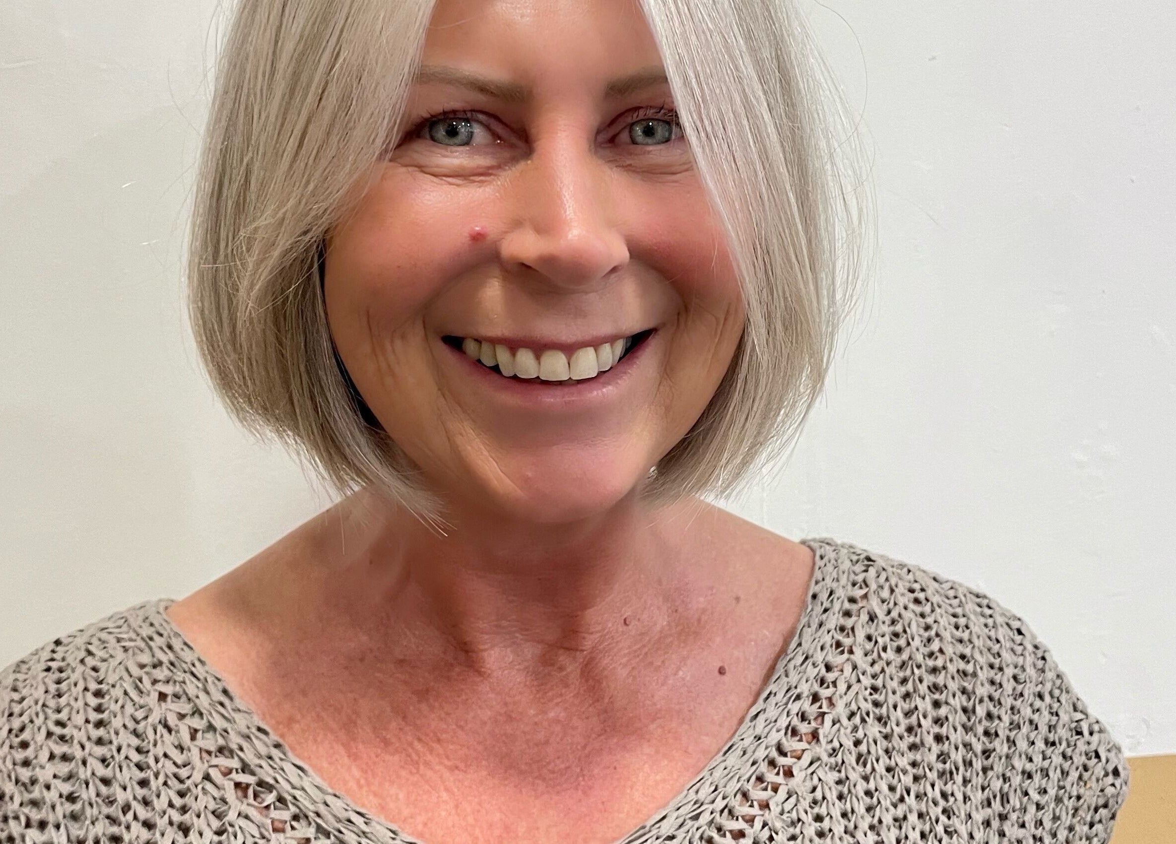 Smiling client with short hair at Hair by Holli J, Renaissance Leeds, Leeds, GB.