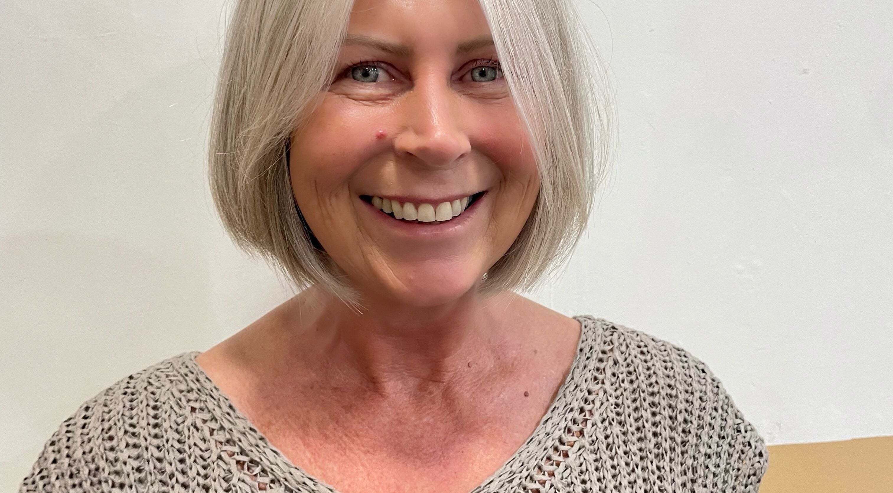 Smiling client with short hair at Hair by Holli J, Renaissance Leeds, Leeds, GB.
