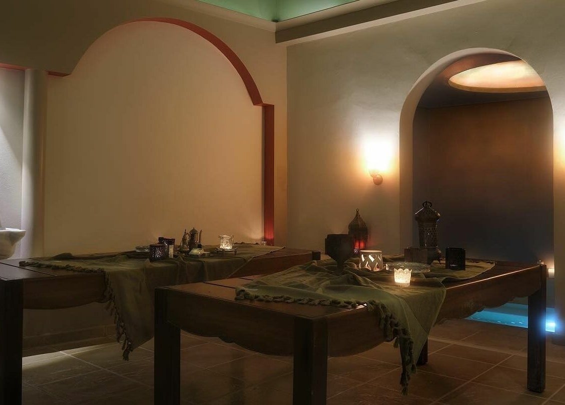 Luxurious spa room at Eressian Hammam and Spa, Ερεσός, GR, featuring massage tables and soft lighting.