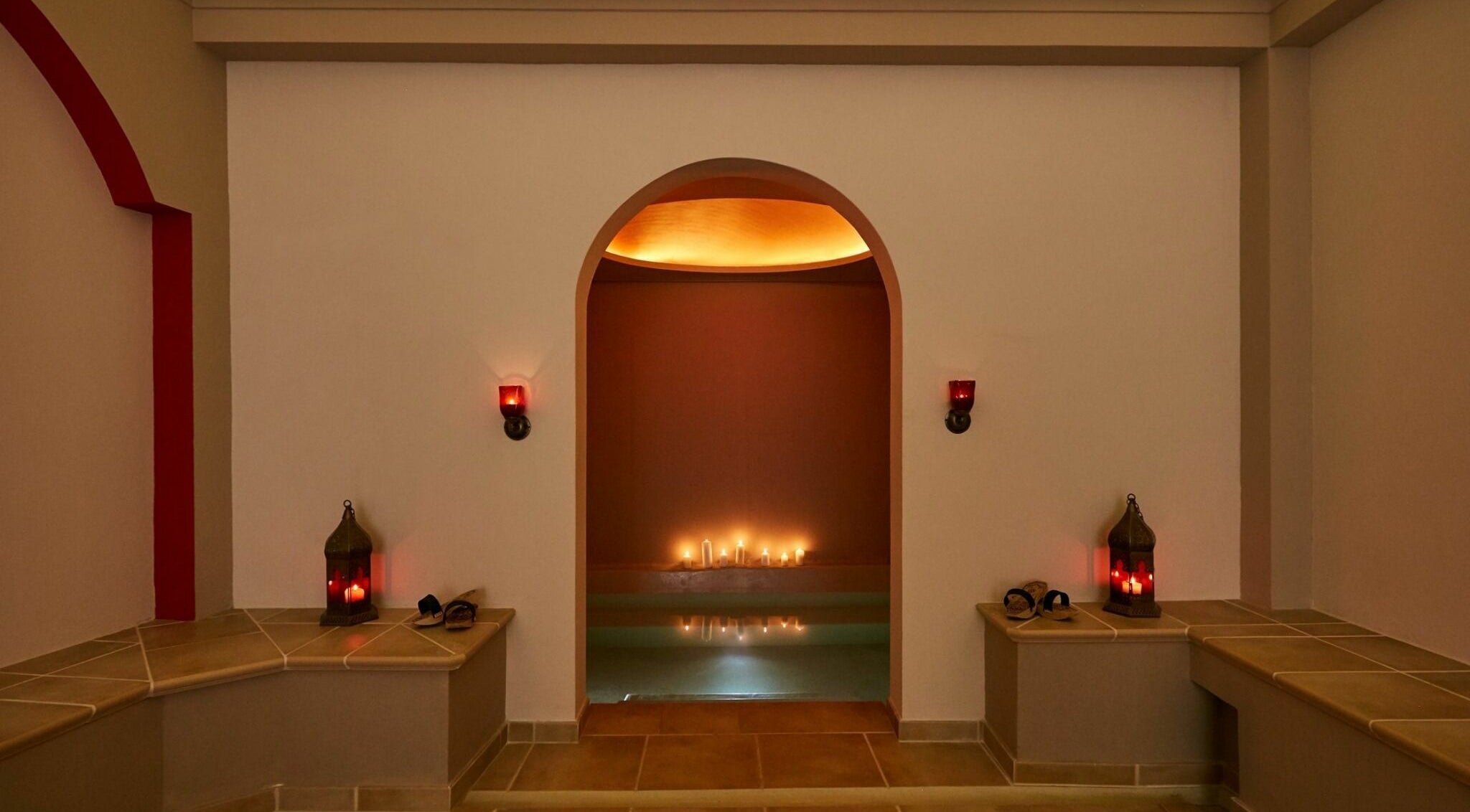 Serene candlelit room at Eressian Hammam and Spa, Ερεσός, GR, offering a tranquil wellness experience.