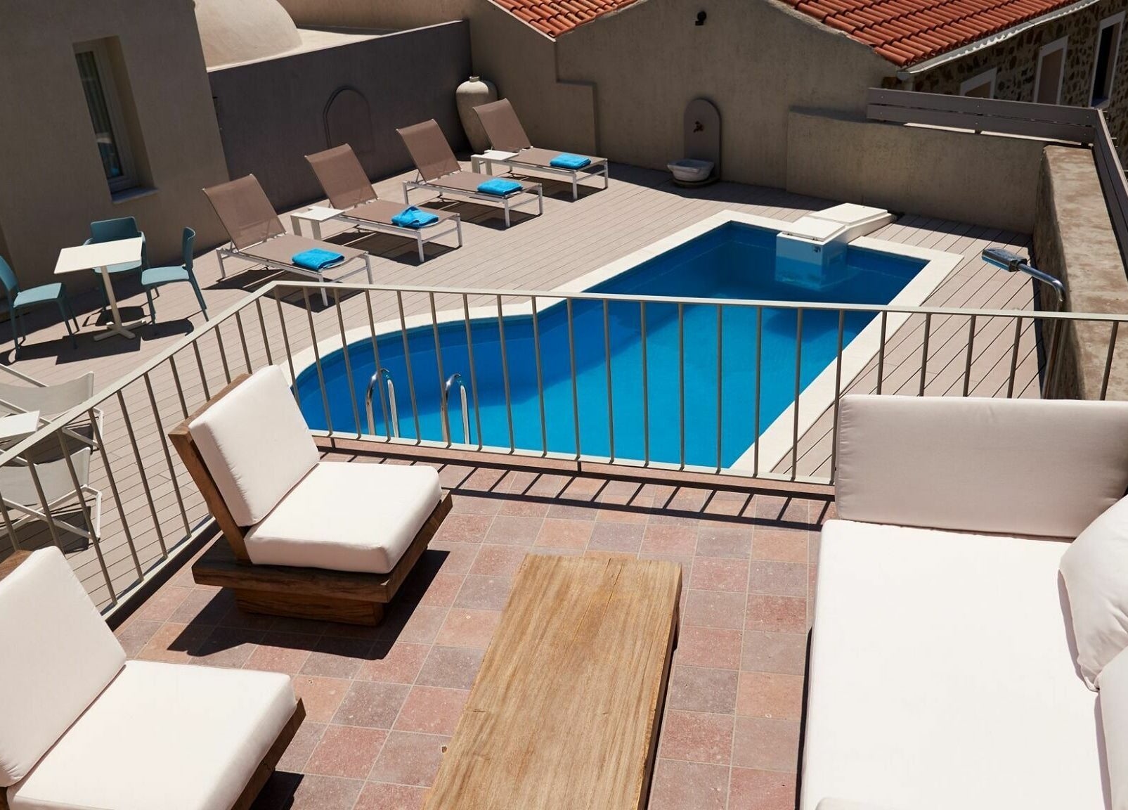 Relaxing pool area at Eressian Hammam and Spa, Ερεσός, GR featuring lounge chairs and serene ambiance.