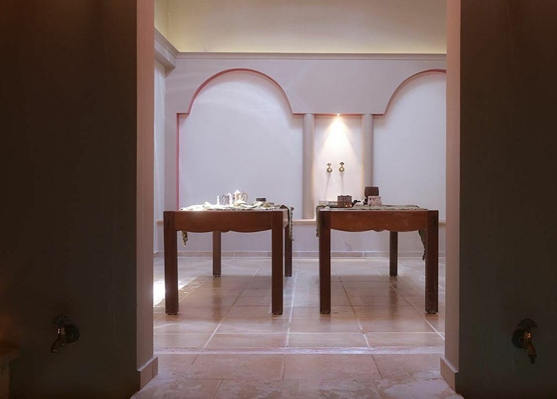 Serene hammam with elegant wooden tables at Eressian Hammam and Spa, Ερεσός, GR. Perfect for relaxation.
