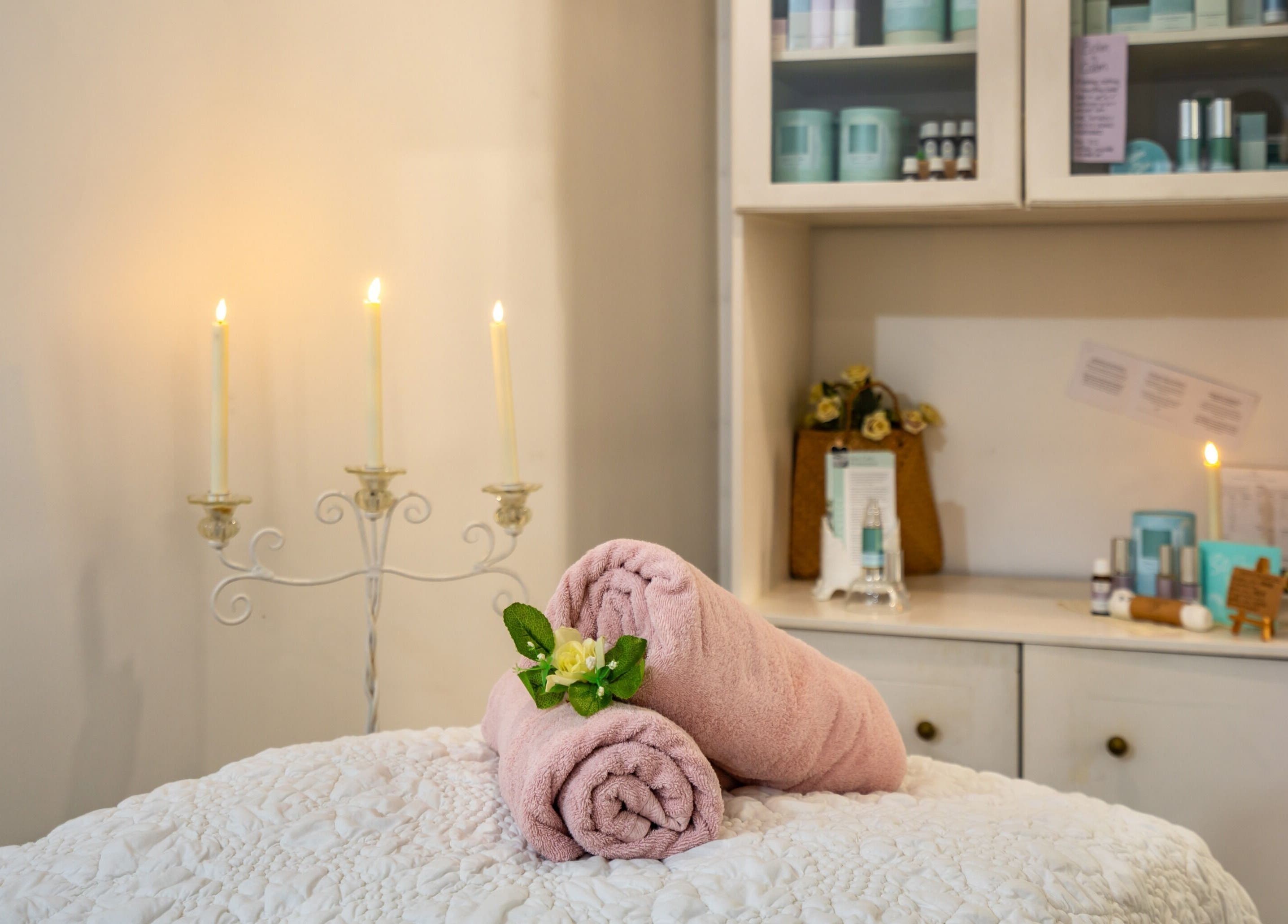Relaxing spa setup with candles and towels at Jodi Lea Natural Beauty, Auckland, Auckland, NZ.