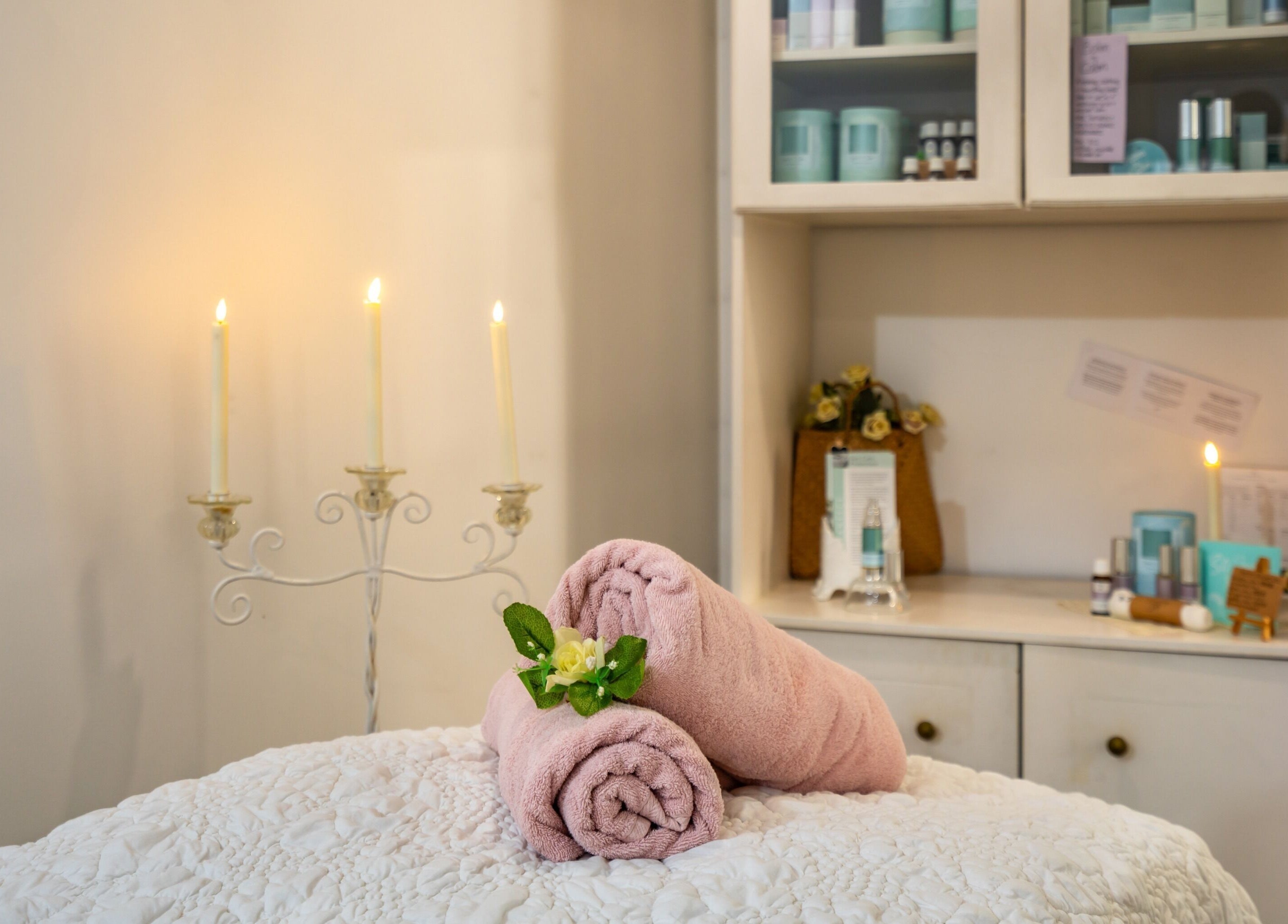 Relaxing spa setup with candles and towels at Jodi Lea Natural Beauty, Auckland, Auckland, NZ.