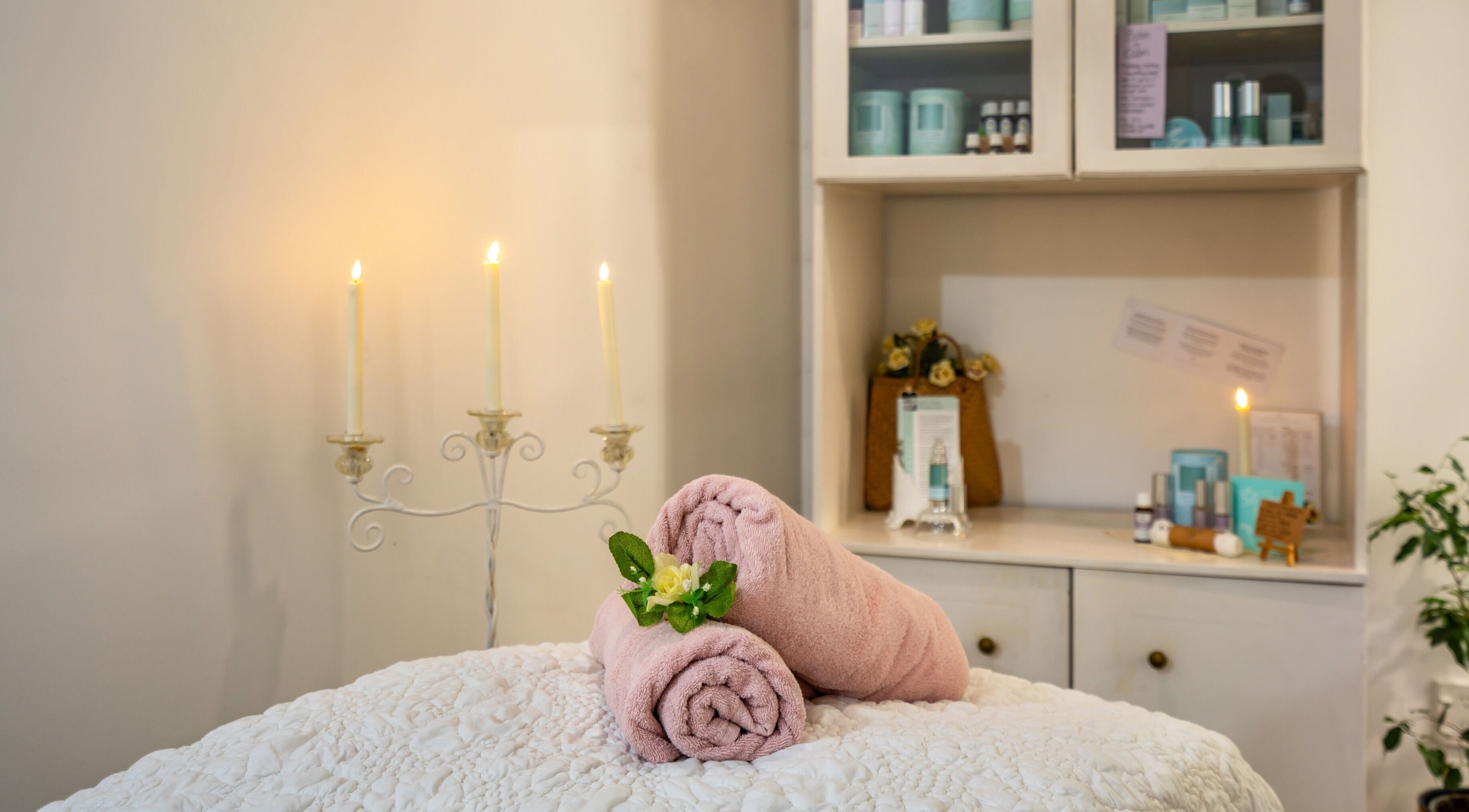 Relaxing spa setup with candles and towels at Jodi Lea Natural Beauty, Auckland, Auckland, NZ.