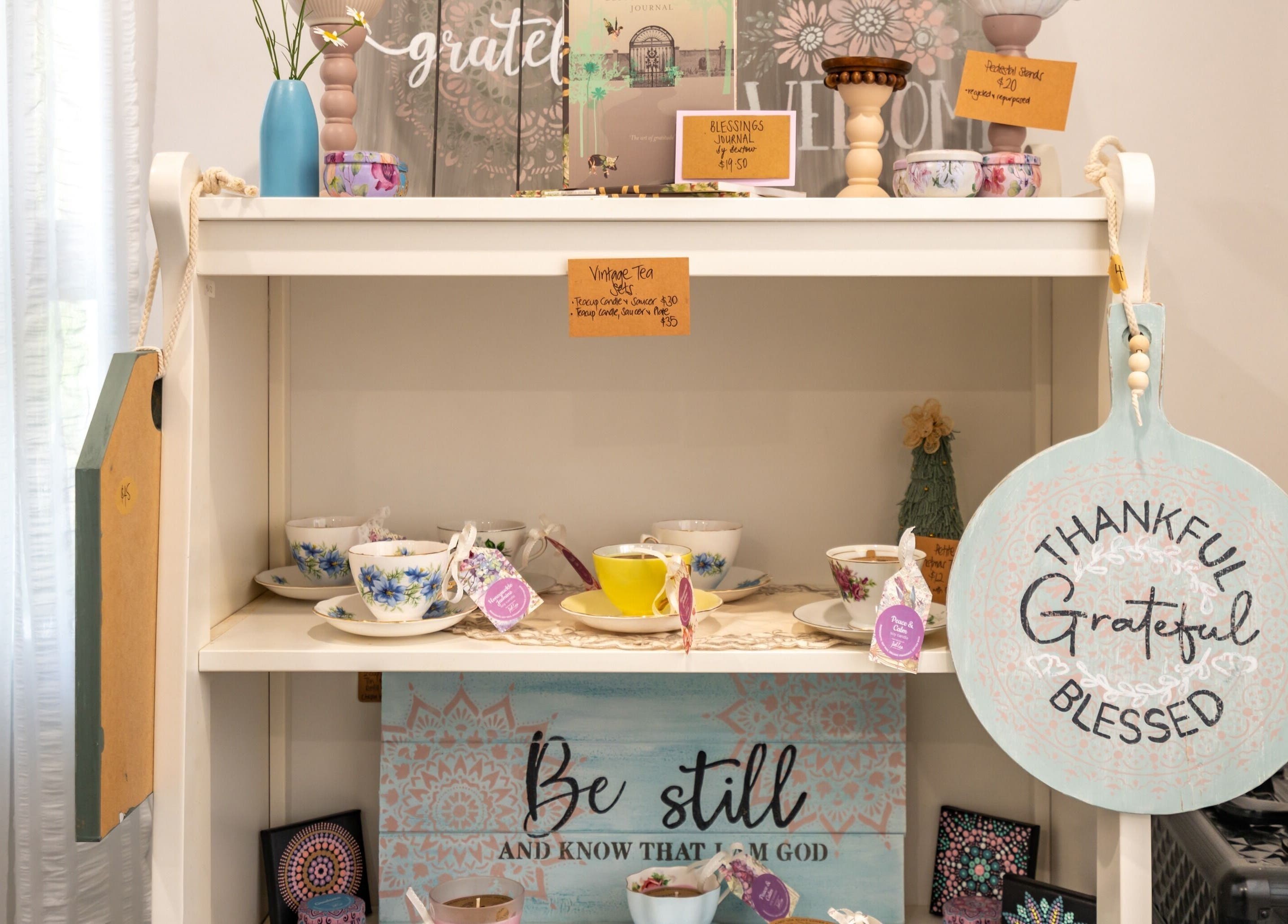 Chic vintage tea set display at Jodi Lea Natural Beauty in Auckland, Auckland, NZ, exuding a cozy, welcoming vibe.