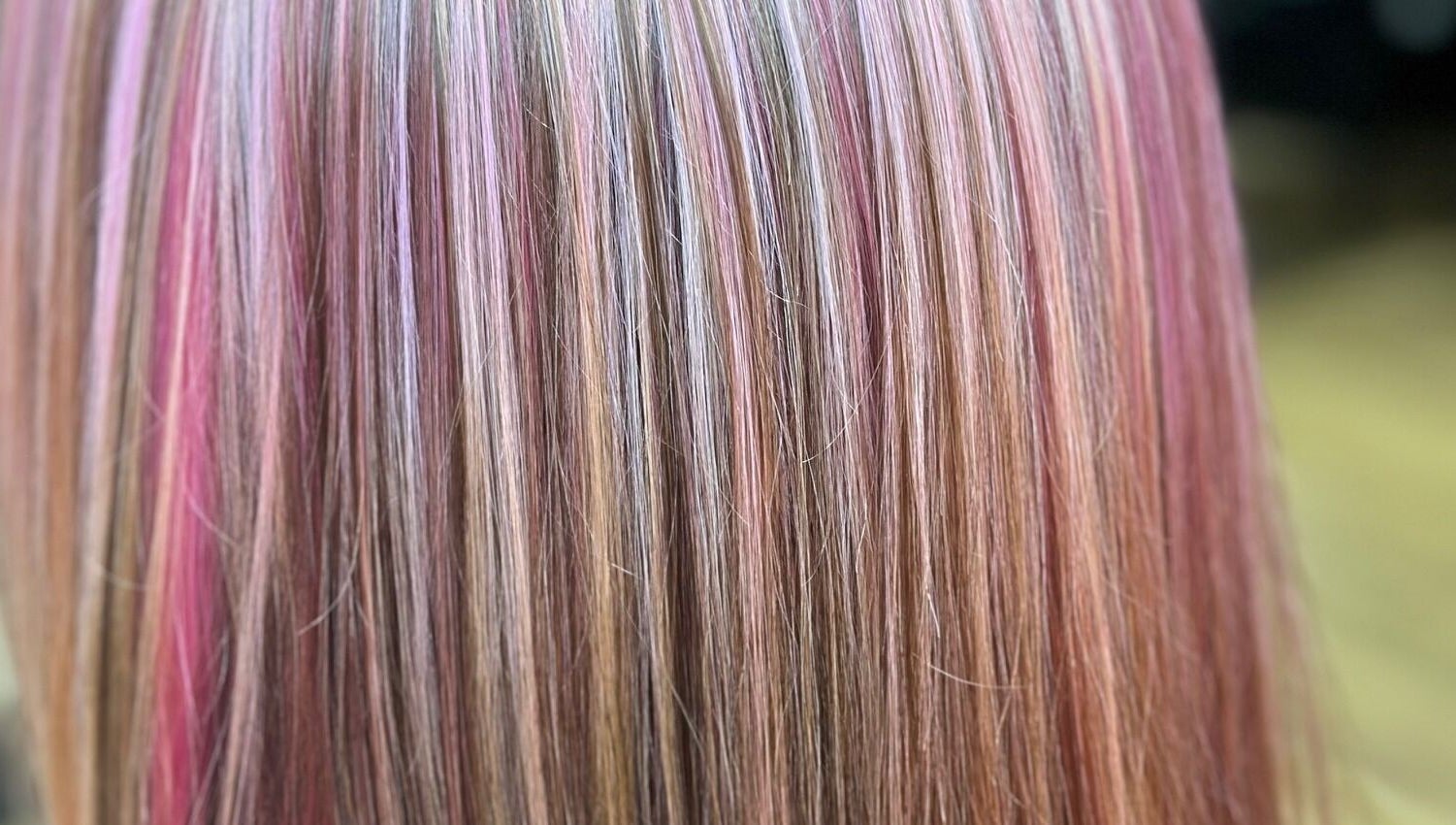 Sally Hoo salon in Hagerstown, Maryland, US showcases vibrant, multi-colored hair highlights.