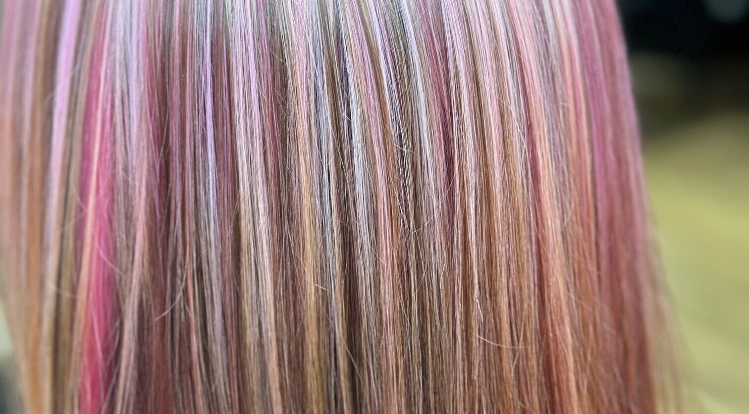 Sally Hoo salon in Hagerstown, Maryland, US showcases vibrant, multi-colored hair highlights.