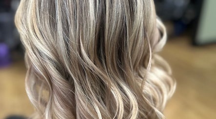 Soft blonde waves styled beautifully at Sally Hoo in Hagerstown, Maryland, US.