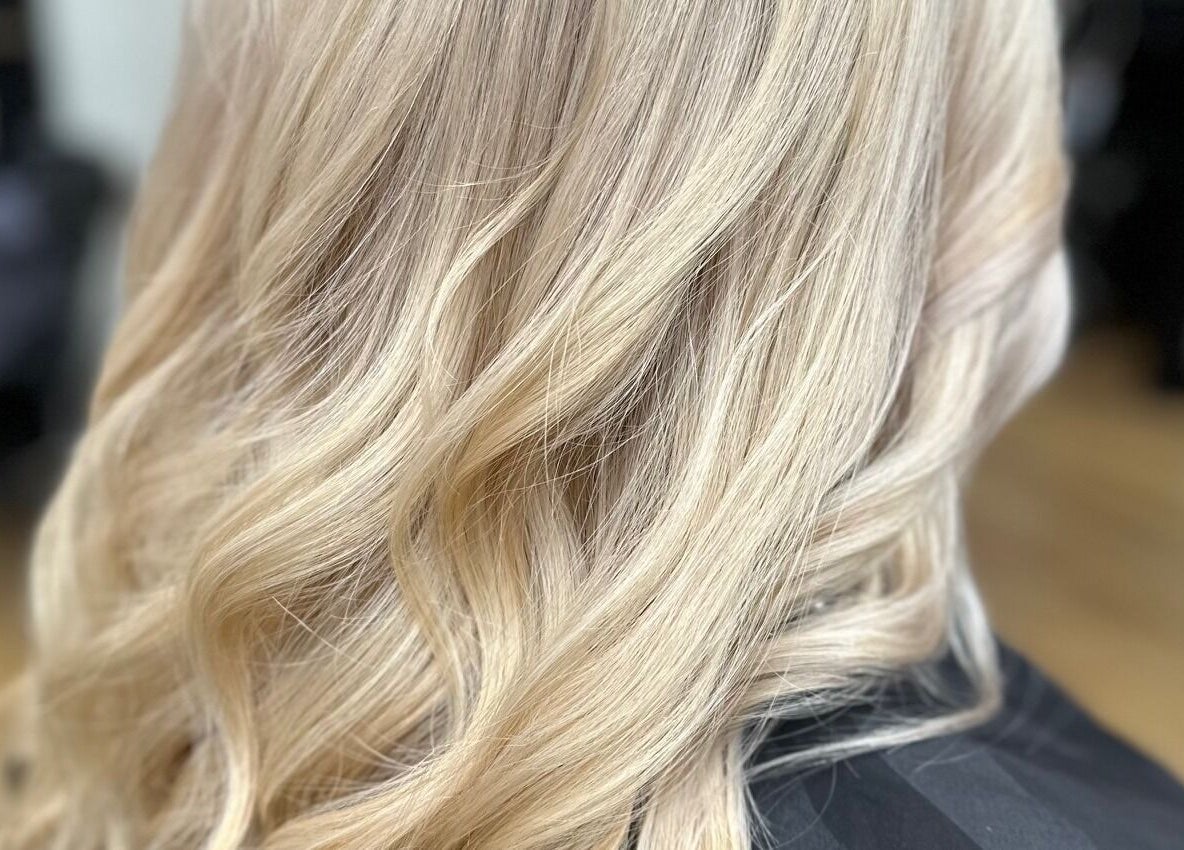 Blonde, wavy hair styled at Sally Hoo, Hagerstown, Maryland, US.