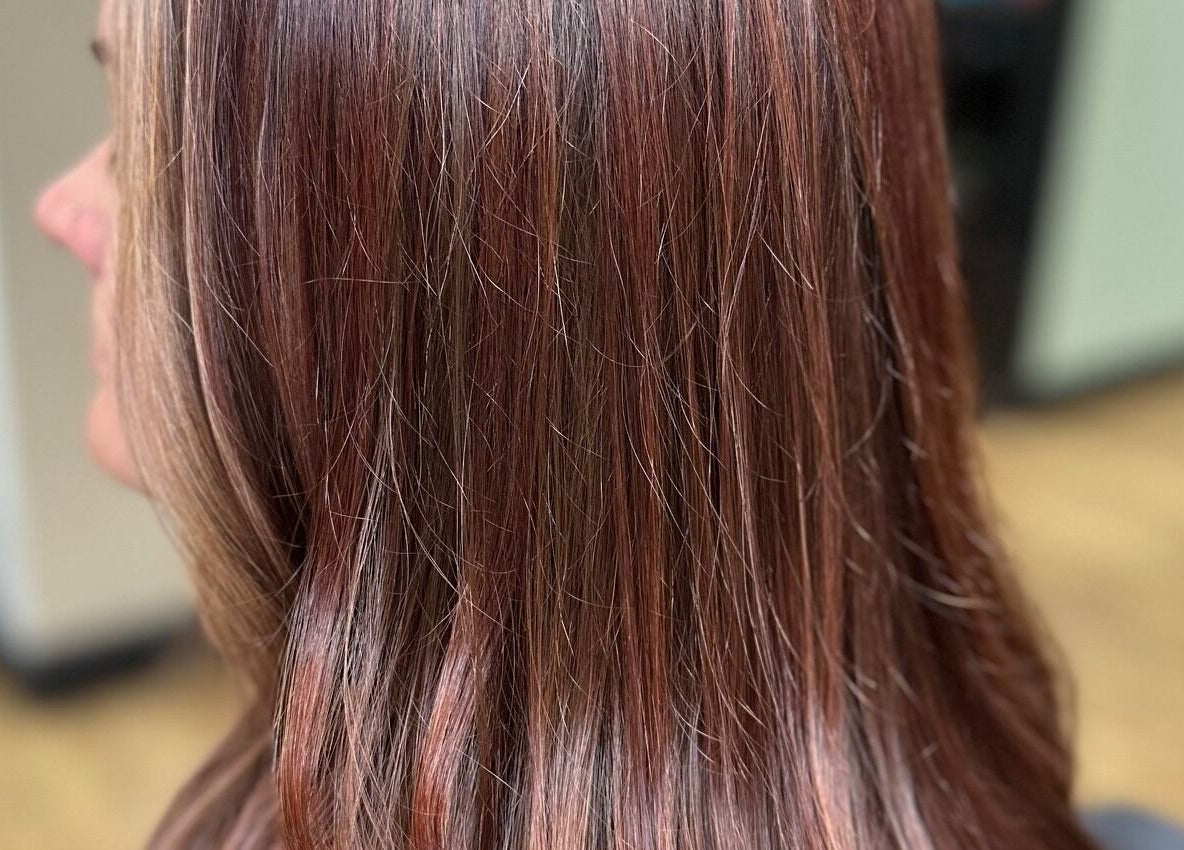 Smooth brunette hair with highlights at Sally Hoo, Hagerstown, Maryland, US. Elegant salon styling.