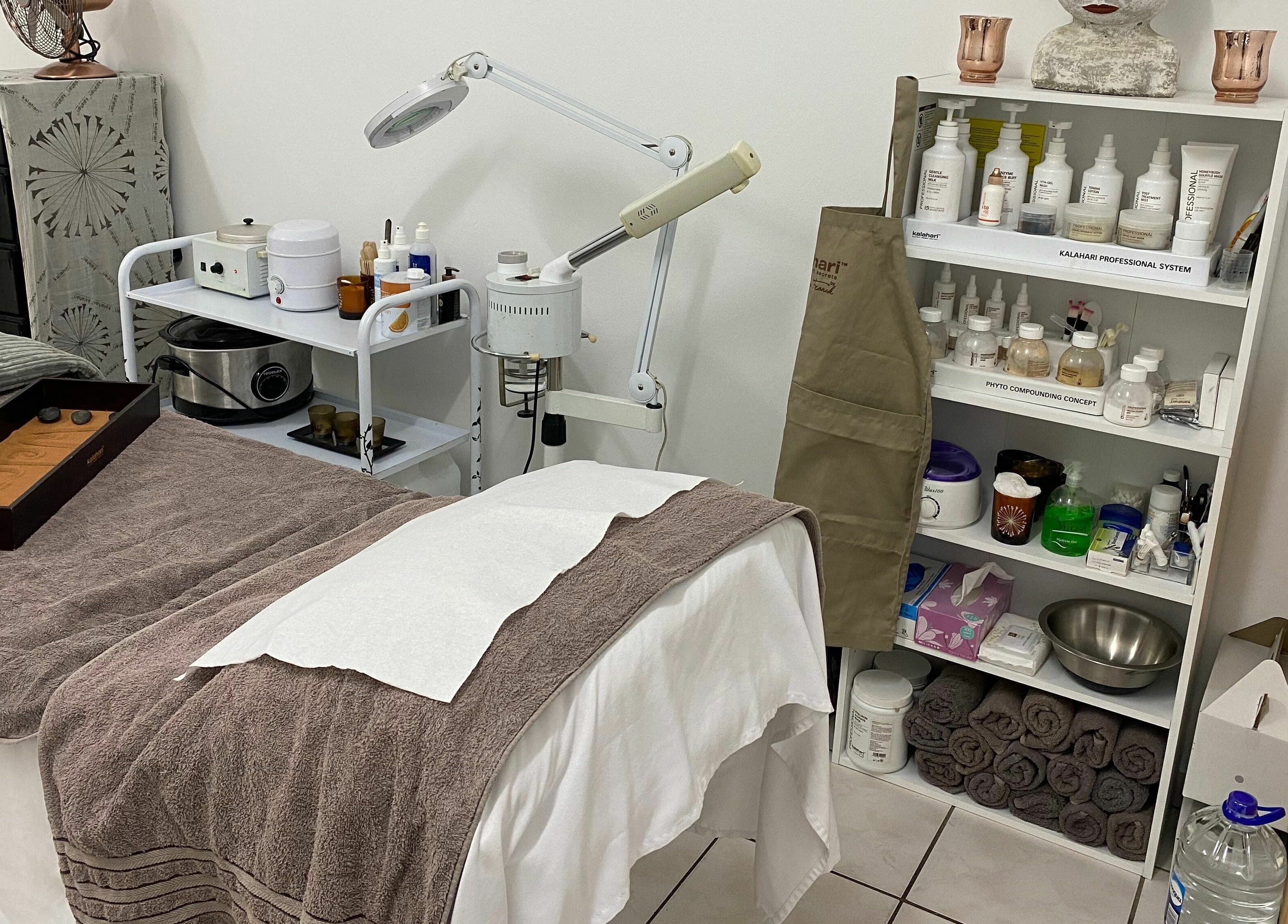 Cozy treatment room at Sublimity, Modimolle, Limpopo, ZA showcasing a massage table and skincare products.