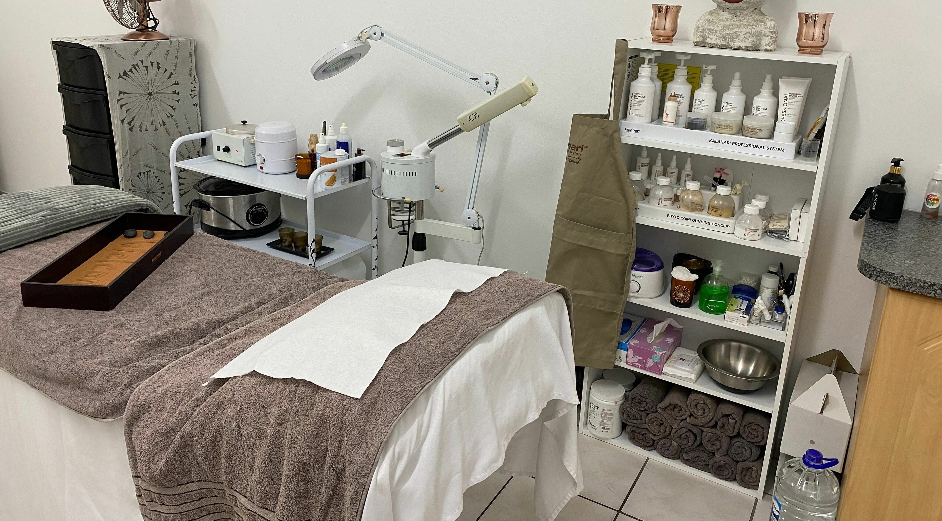 Cozy treatment room at Sublimity, Modimolle, Limpopo, ZA showcasing a massage table and skincare products.