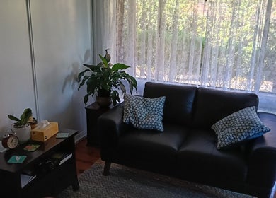 Inviting lounge with black sofa at Celeste Salter Faulconbridge Clinic, Faulconbridge, New South Wales, AU.