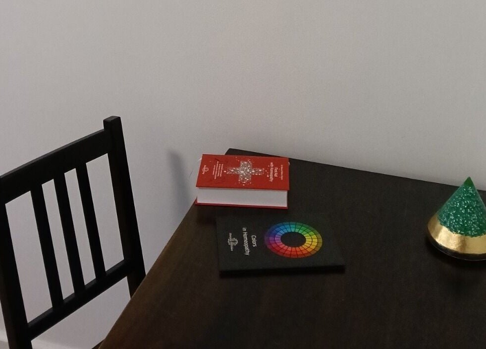 A peaceful desk setup at Celeste Salter Faulconbridge Clinic, Faulconbridge, New South Wales, AU featuring books and decor.