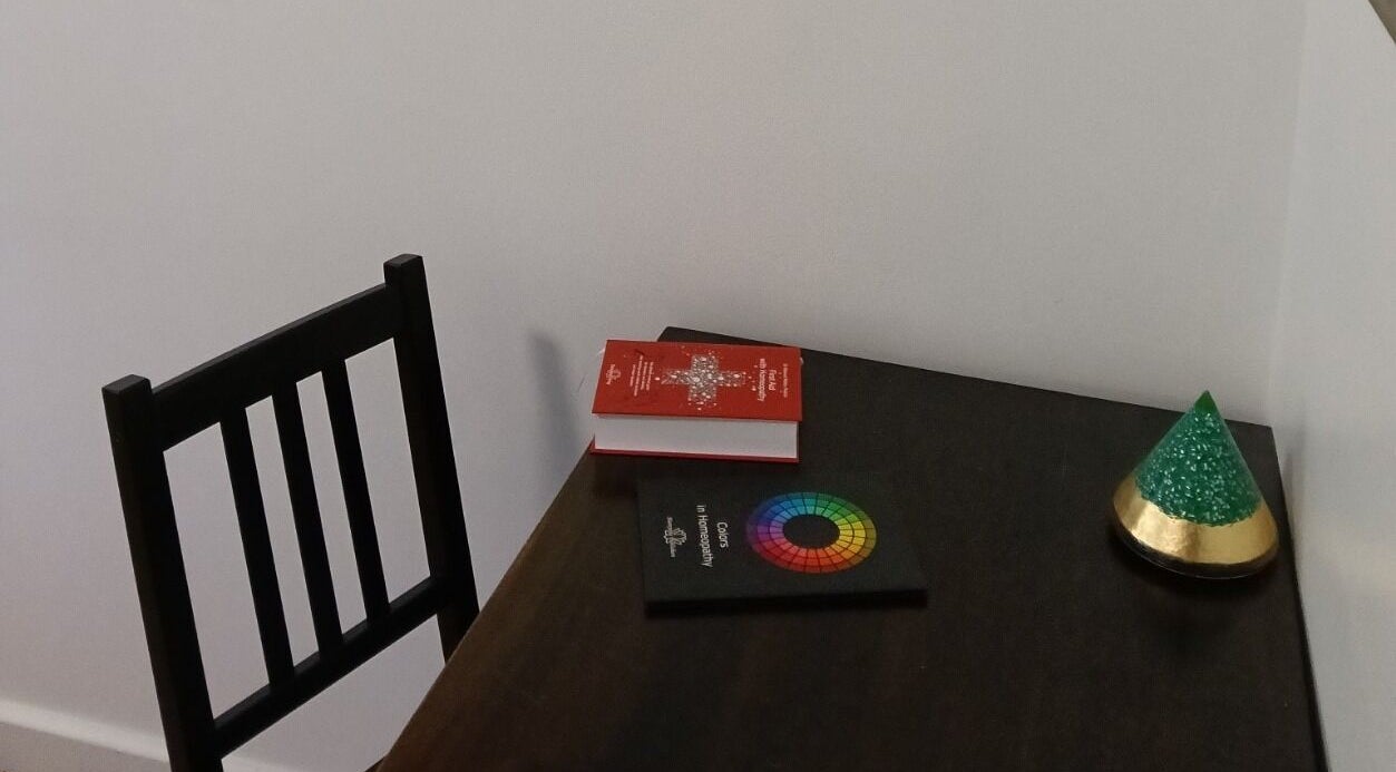 A peaceful desk setup at Celeste Salter Faulconbridge Clinic, Faulconbridge, New South Wales, AU featuring books and decor.