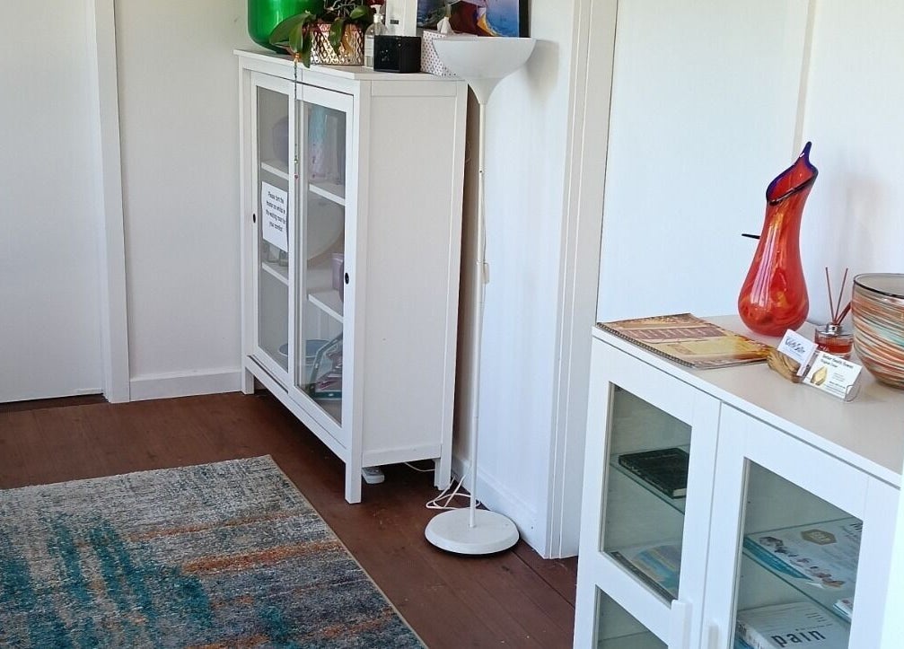 Cozy waiting area with glass cabinets at Celeste Salter Faulconbridge Clinic, Faulconbridge, New South Wales, AU.