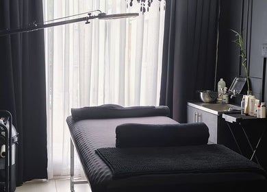 Elegant treatment room at Simplicity Beauty Clinic, Rustenburg, North West, ZA with modern decor and comfy bed.
