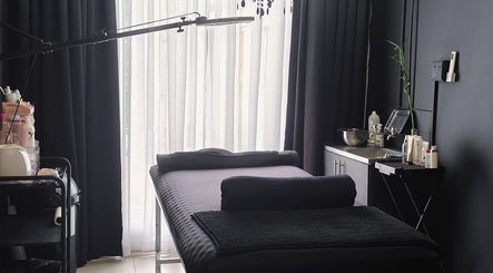 Elegant treatment room at Simplicity Beauty Clinic, Rustenburg, North West, ZA with modern decor and comfy bed.