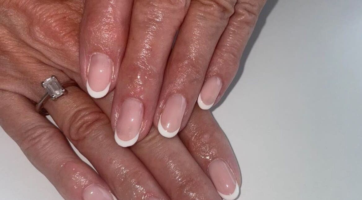 French manicure at BARE, Port Glasgow, Scotland, GB showing elegant, polished nails.