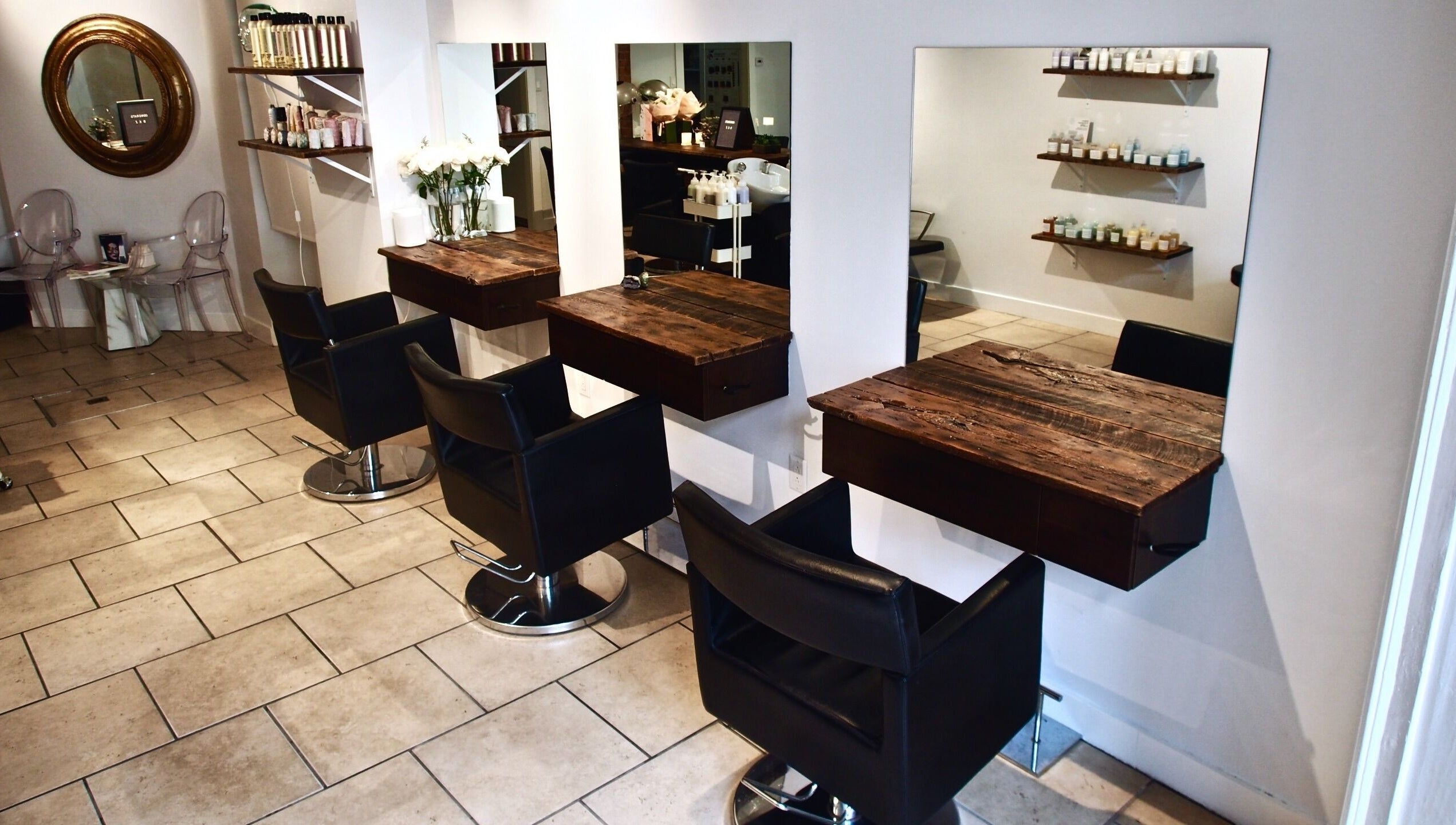 Maison L.A.B salon interior with stylish chairs and wooden counters in Montréal, Québec, CA.