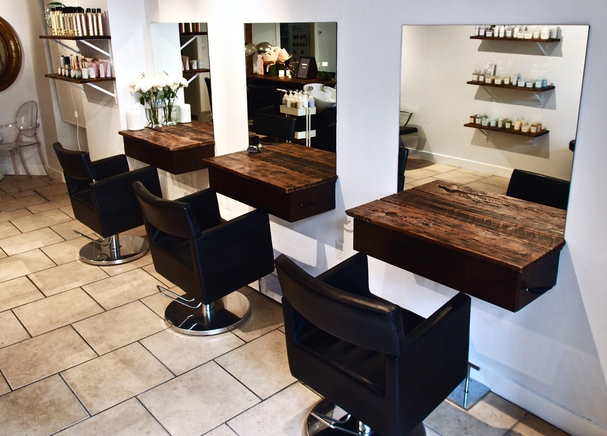 Maison L.A.B salon interior with stylish chairs and wooden counters in Montréal, Québec, CA.
