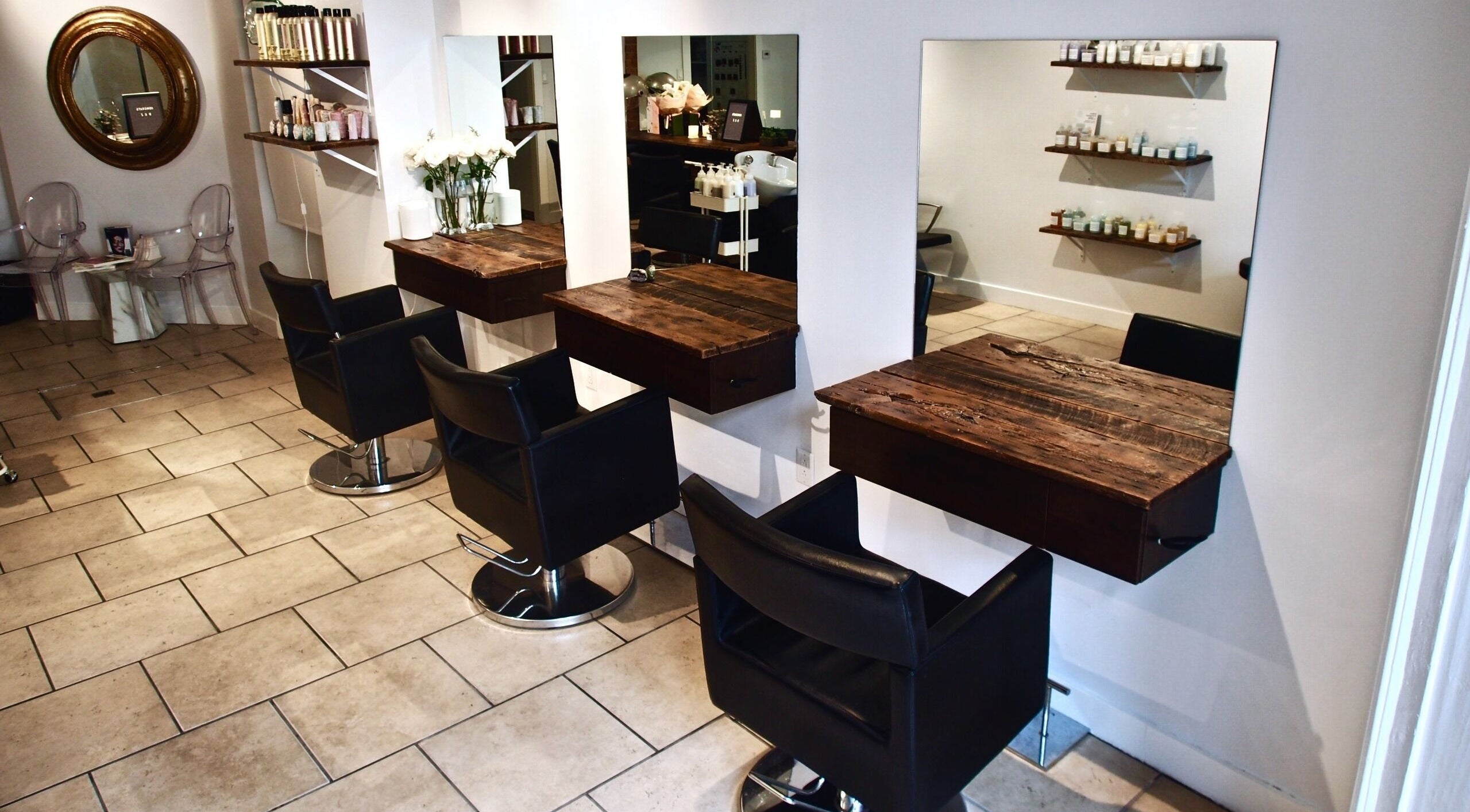 Maison L.A.B salon interior with stylish chairs and wooden counters in Montréal, Québec, CA.