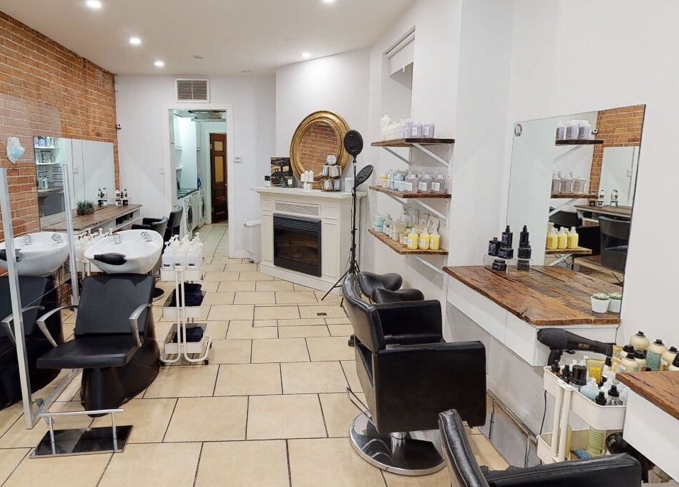 Interior of Maison L.A.B in Montréal, Québec, CA, showcasing modern salon chairs and hairwashing stations.