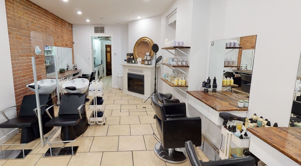 Interior of Maison L.A.B in Montréal, Québec, CA, showcasing modern salon chairs and hairwashing stations.