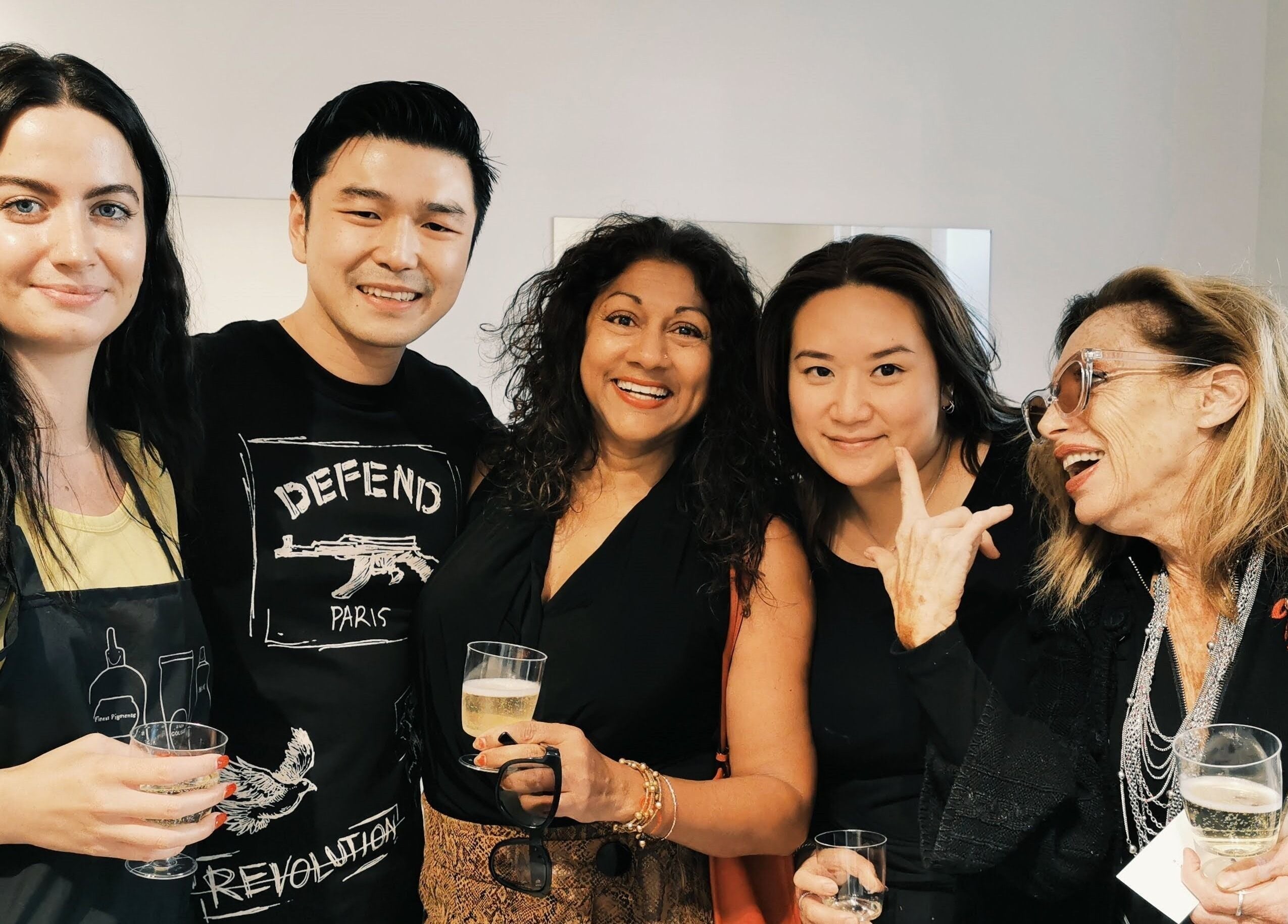 Group of diverse adults enjoying a social event at Maison L.A.B, Montréal, Québec, CA.