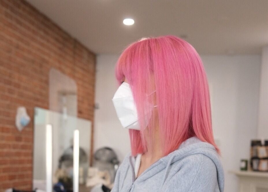 Client with pink hair at Maison L.A.B, Montréal, Québec, CA, showcasing vibrant salon styling.