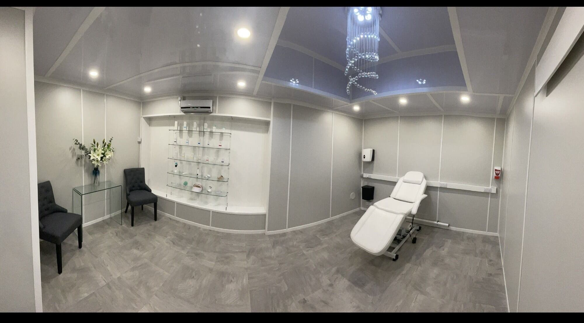 Modern treatment room at Body Aesthetics, Southend-on-Sea, England. Features recliner and elegant decor.