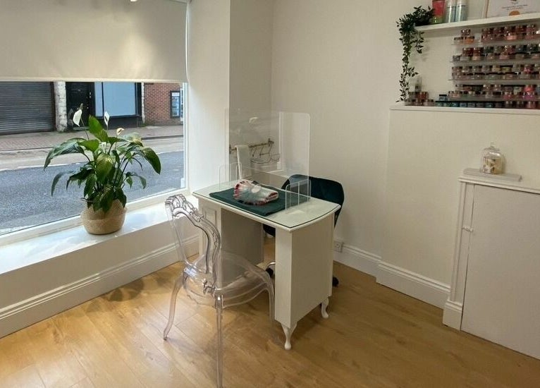 Cozy interior of The Lash Gallery in Knaresborough, England with a stylish nail station and decor.