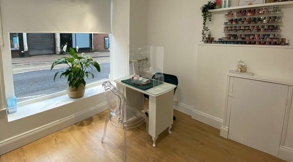 Cozy interior of The Lash Gallery in Knaresborough, England with a stylish nail station and decor.
