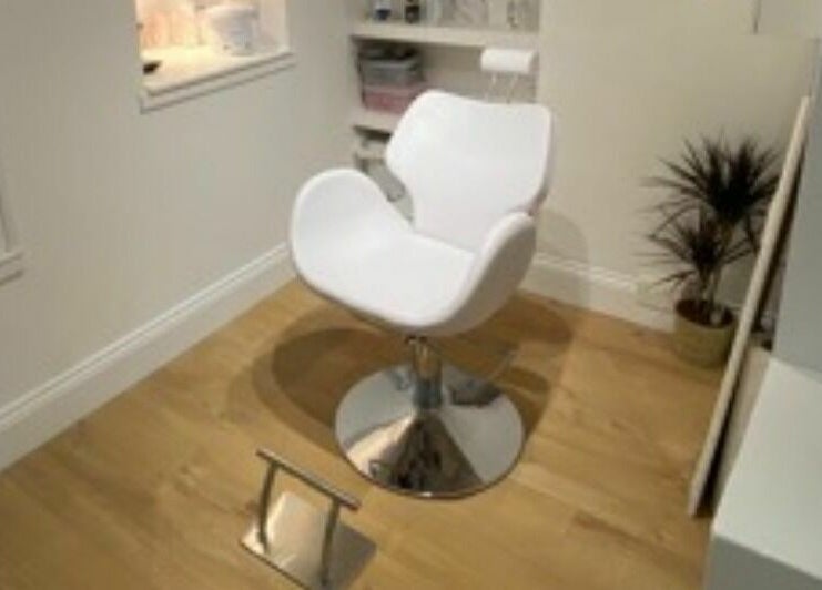 White salon chair at The Lash Gallery, Knaresborough, England, GB, offering a stylish and comfortable experience.