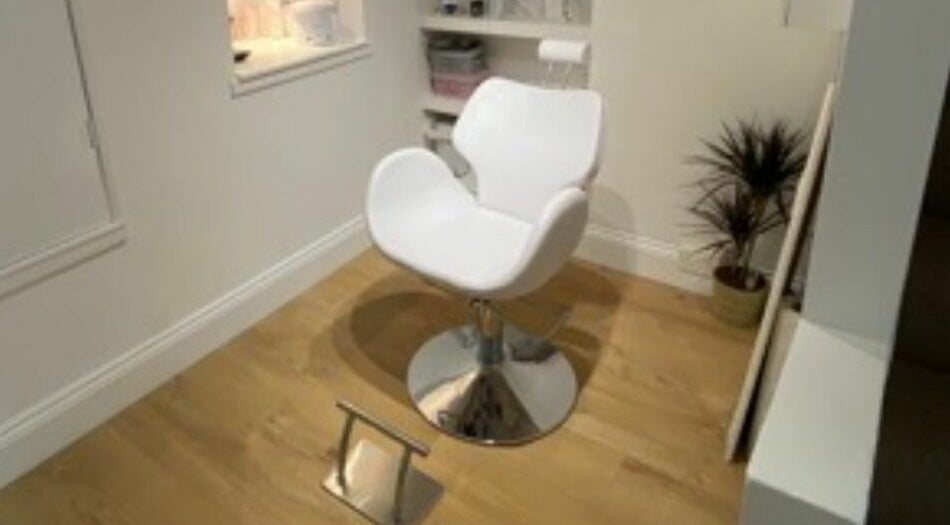 White salon chair at The Lash Gallery, Knaresborough, England, GB, offering a stylish and comfortable experience.
