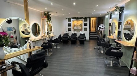 Modern salon interior at Cheshire Hair & Beauty, Nantwich, England, GB featuring sleek hair stations and lighting.