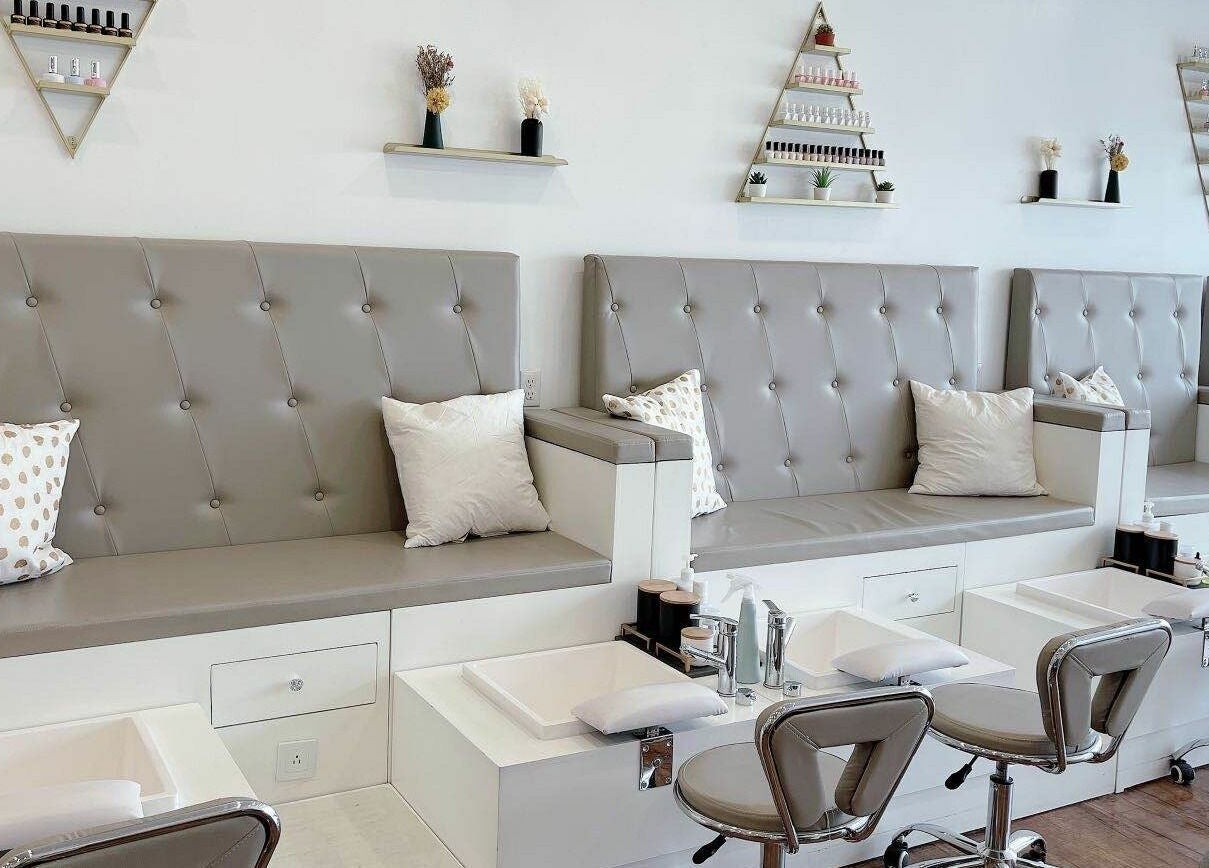 Modern pedicure stations at Kuo Qi Nails, Toronto, Ontario, CA with elegant seating and decor.