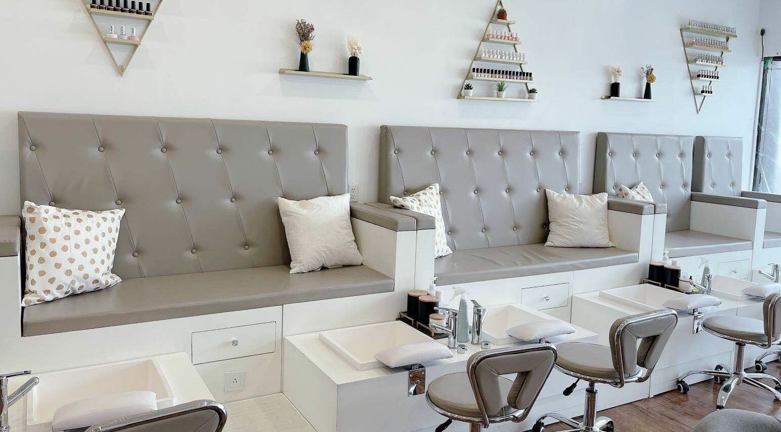 Modern pedicure stations at Kuo Qi Nails, Toronto, Ontario, CA with elegant seating and decor.