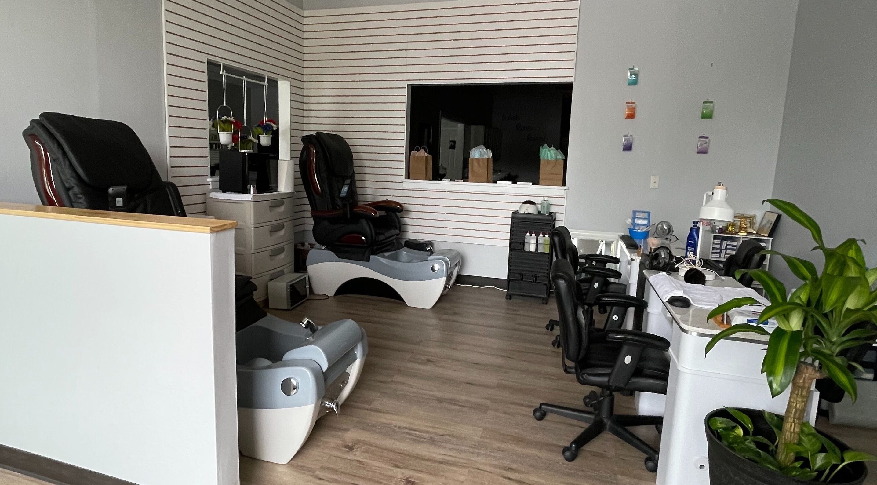 Pedicure chairs and nail stations at Lek Nails and Toes in Sykesville, Maryland, US, creating a serene atmosphere.