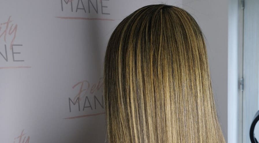 Sleek, highlighted hair showcased at DeityMANE Salon space, London, England, GB.