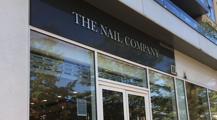 The Nail Company entrance in London, England, GB showcasing sleek glass and signage.