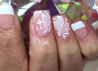 Elegant floral nail art with French tips at Face & Body Studio SA, Boksburg, Gauteng, ZA.