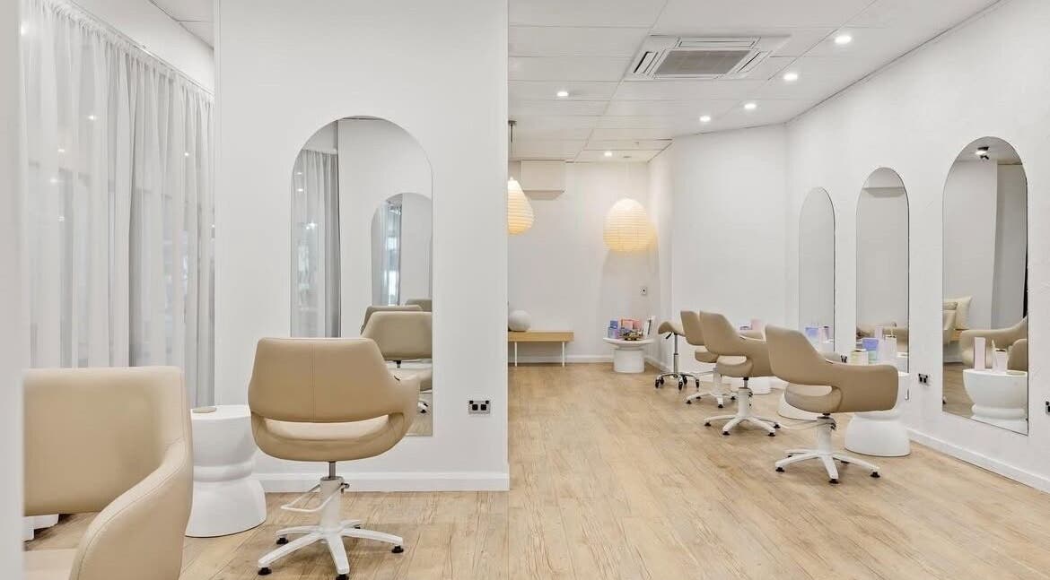 Elegant interior of Livelle Hair Studio, Coffs Harbour, New South Wales, AU with chic styling chairs and mirrors.