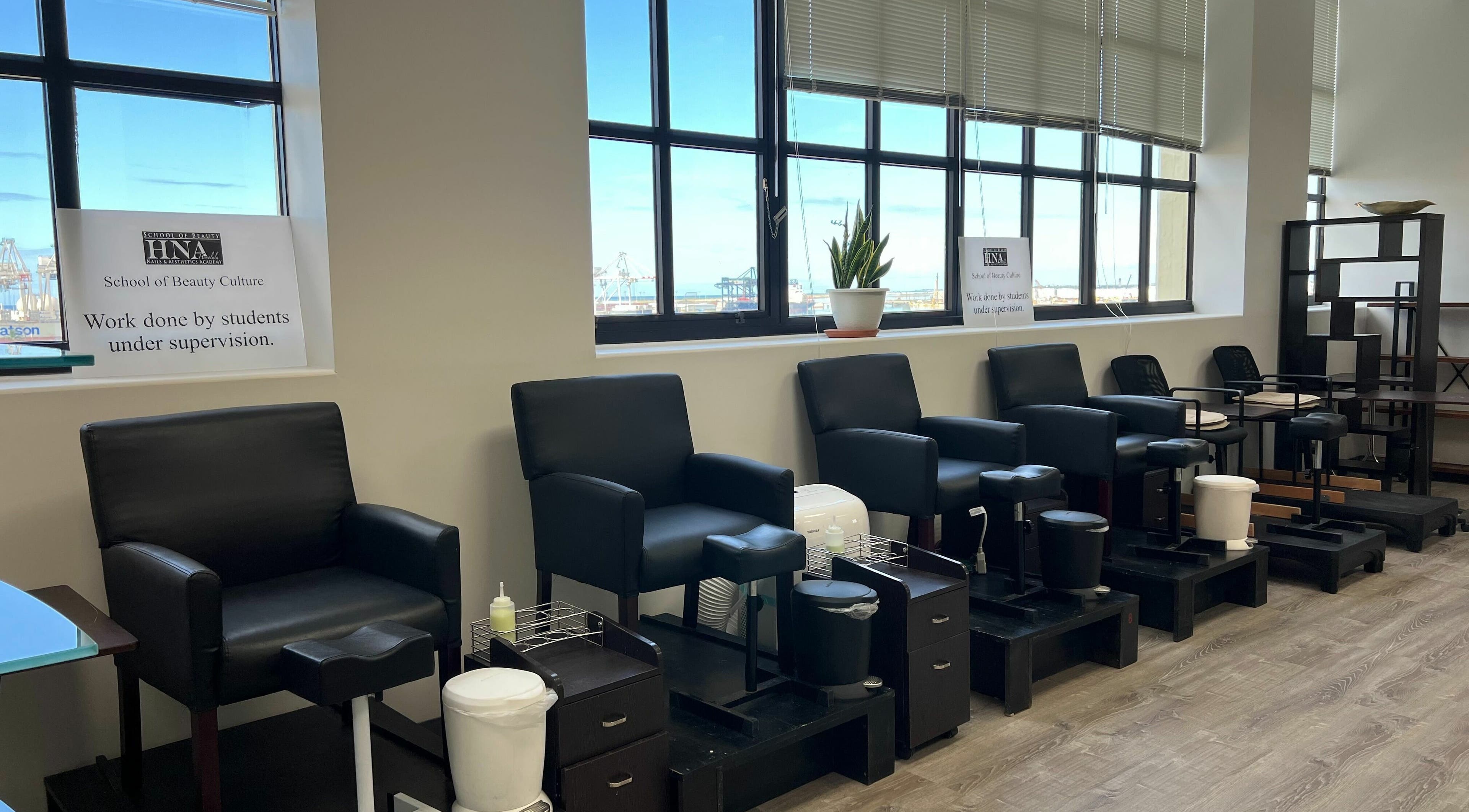 Modern pedicure chairs at Honolulu Nails & Aesthetics Academy, Honolulu, Hawaii, US, ready for treatments.