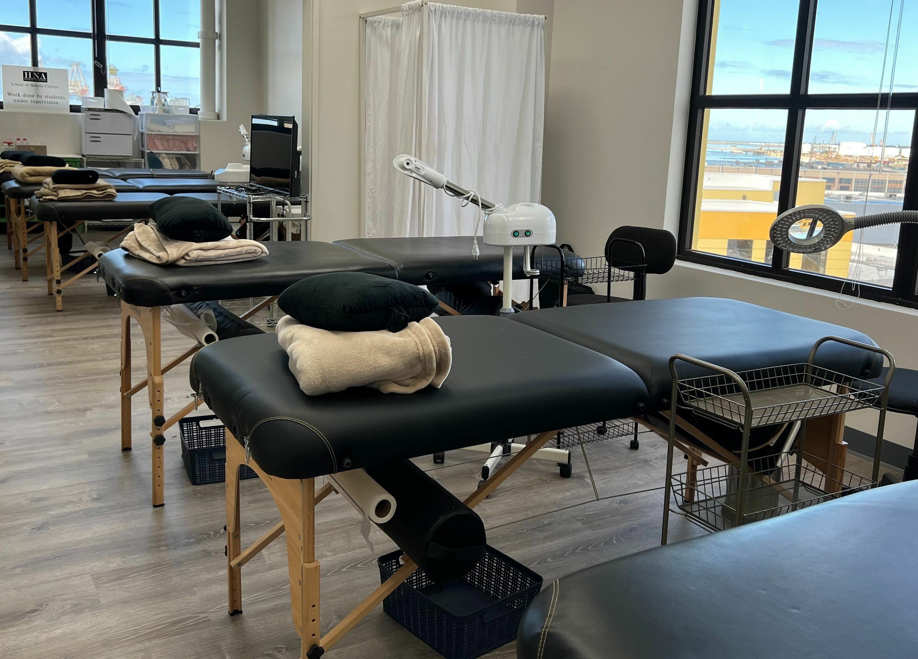 Massage tables at Honolulu Nails & Aesthetics Academy with ocean view, Honolulu, Hawaii, US.