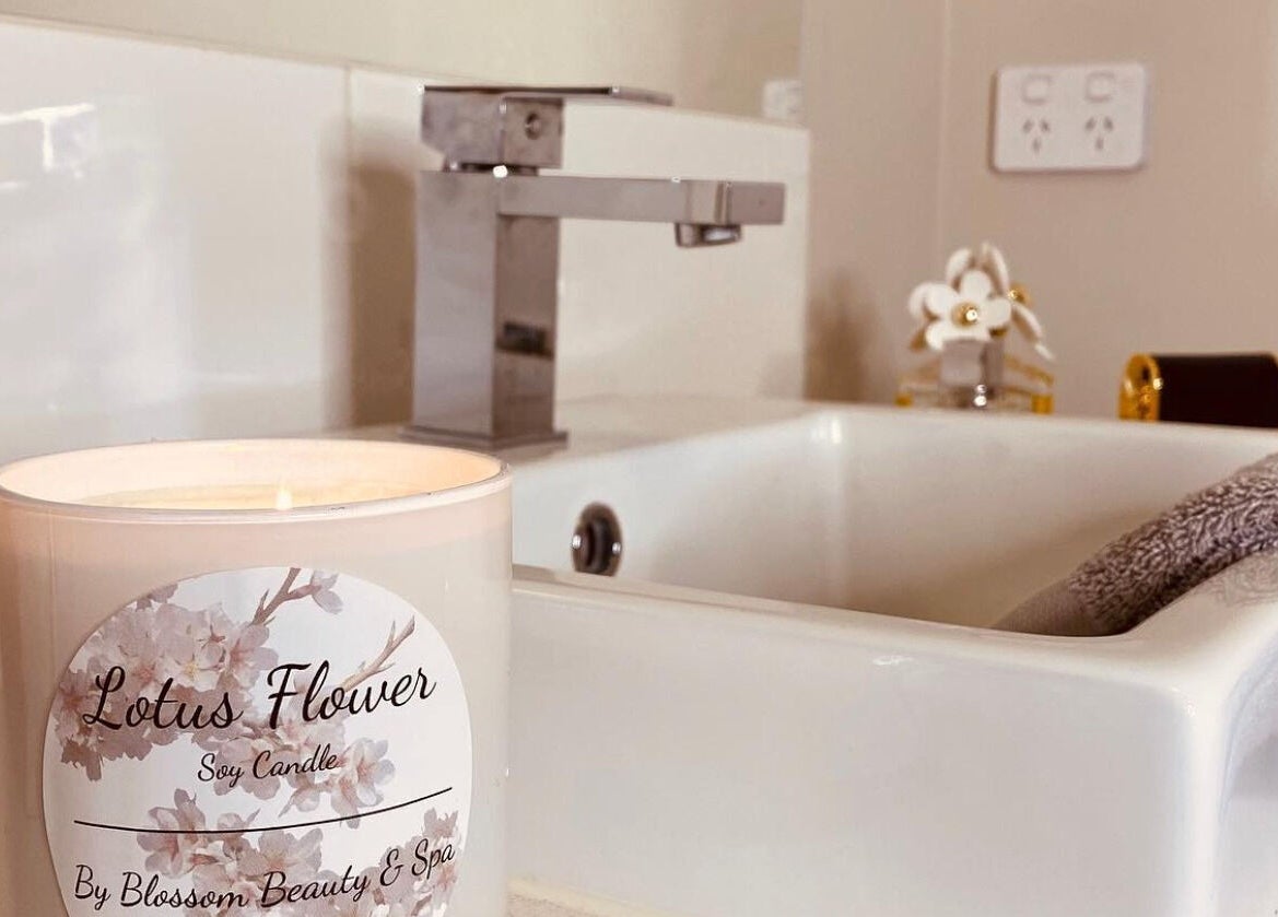 Lotus Flower candle by Blossom Beauty and Spa, Aintree, Victoria, AU, enhancing a serene bathroom atmosphere.
